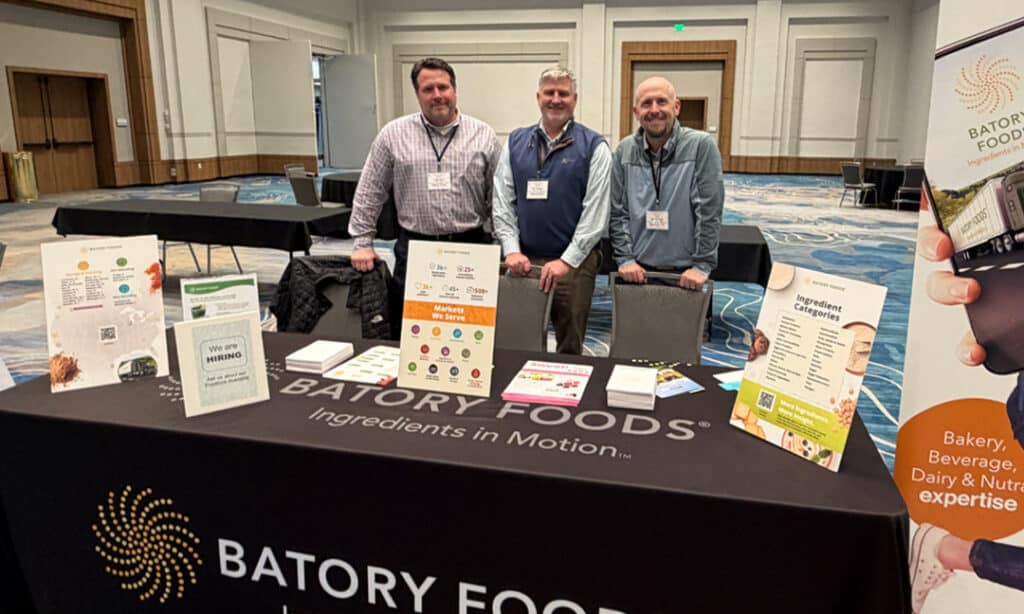 Batory Account Reps at a regional trade show behind the Batory Foods' booth